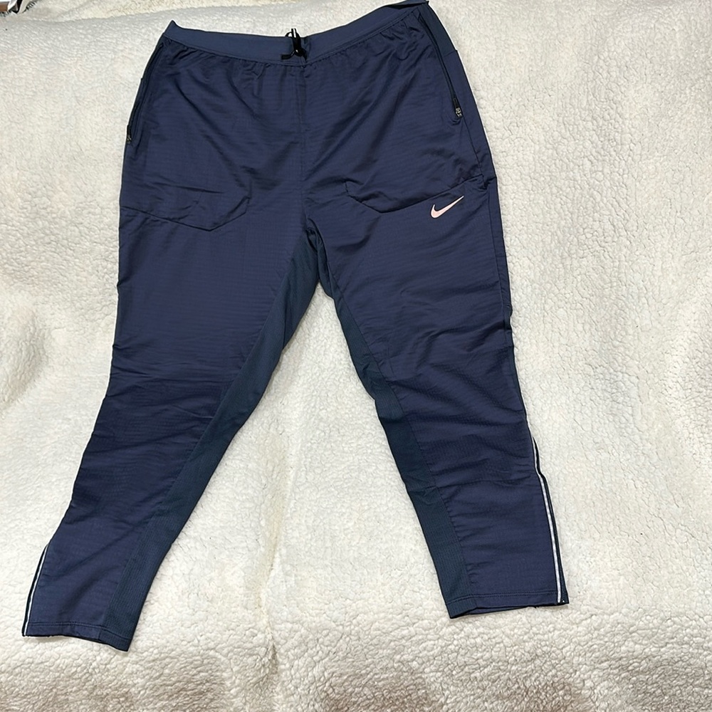 Nike running pants. Never worn. Light blue in color